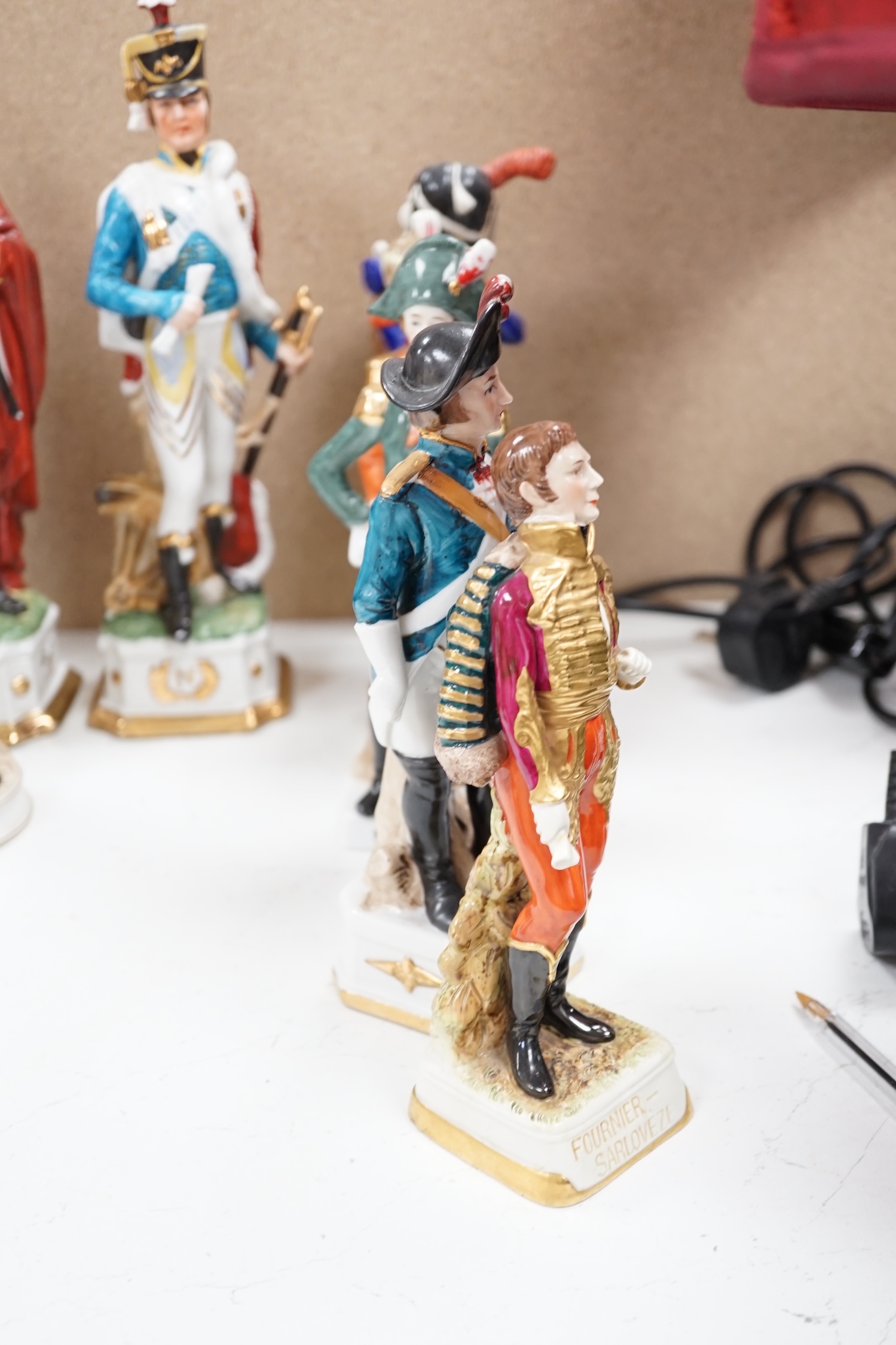 A group of thirteen naval/military figures, tallest 32cm high